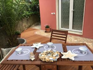 a wooden table with stars and plates on it at Albamare in Monterosso al Mare