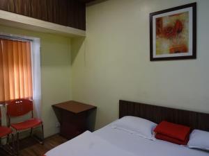 Postel nebo postele na pokoji v ubytování Monovilla Inn + 11 fotografií