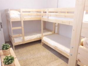 Łóżko lub łóżka w pokoju w obiekcie CH Apartments
