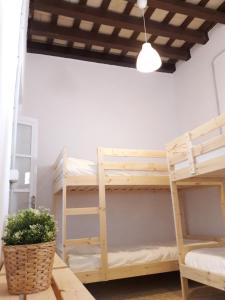 Łóżko lub łóżka w pokoju w obiekcie CH Apartments