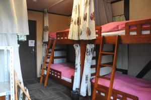 Voodi või voodid majutusasutuse Sakura Guest House toas