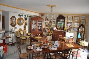 a dining room with tables and chairs in a room at Affittacamere Al Gattopardo Favignana in Favignana