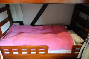 Voodi või voodid majutusasutuse Sakura Guest House toas
