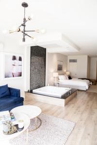 a living room with two beds and a couch at Polperro Villas in Red Hill