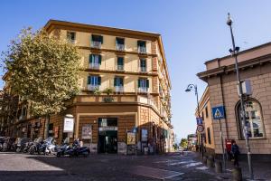 a tall building with motorcycles parked in front of it at Parthenope Suite Rooms in Naples