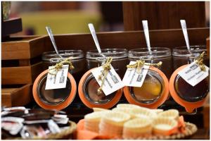 a group of jars of food with tags on them at Motel Plus Berlin in Berlin