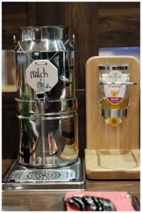 a mixer on a counter with a sticker on it at Motel Plus Berlin in Berlin