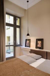 Postel nebo postele na pokoji v ubytování apartament PAULOVE