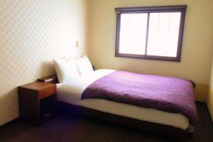 Un ou plusieurs lits dans un hébergement de l'établissement K's House Takayama [1st K's Hostel]