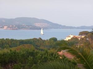 a sail boat in the water with acean at Villa Macoran 2 étoiles in Saint-Aygulf
