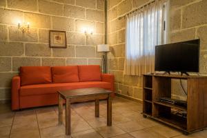 TV a/nebo společenská místnost v ubytování Casitas en el Paraiso