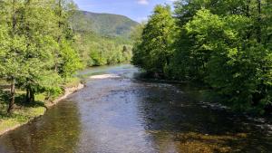 a view of a river from a bridge at Vila Viktorija in Brod na Kupi