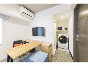 TV a/nebo společenská místnost v ubytování Tokyu Stay Takanawa Shinagawa Area