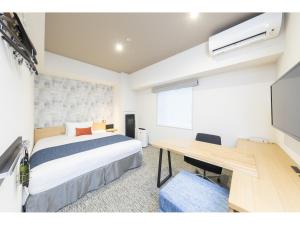 Voodi või voodid majutusasutuse Tokyu Stay Takanawa Shinagawa Area toas