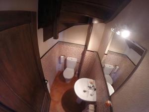 an overhead view of a bathroom with a toilet and a sink at Casa Rural Mollo, Vall de Camprodon in Molló +75 photos
