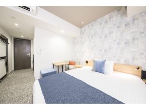 Voodi või voodid majutusasutuse Tokyu Stay Takanawa Shinagawa Area toas