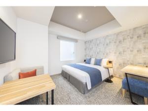 Voodi või voodid majutusasutuse Tokyu Stay Takanawa Shinagawa Area toas