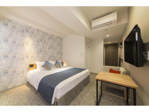 Voodi või voodid majutusasutuse Tokyu Stay Takanawa Shinagawa Area toas