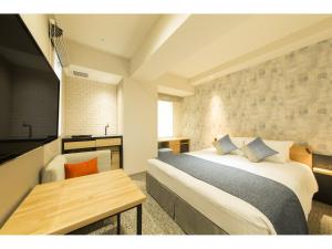 Voodi või voodid majutusasutuse Tokyu Stay Takanawa Shinagawa Area toas
