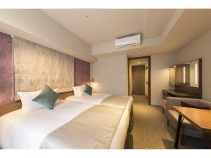 Voodi või voodid majutusasutuse Tokyu Stay Takanawa Shinagawa Area toas