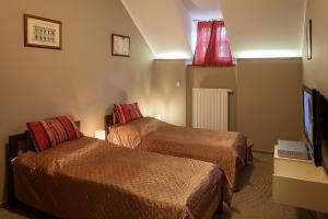 Postel nebo postele na pokoji v ubytování Hotel Merlot