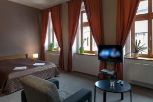 TV a/nebo společenská místnost v ubytování Hotel Merlot