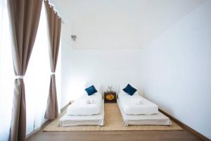 Posteľ alebo postele v izbe v ubytovaní Paolo & Francesca's Trapani Loft