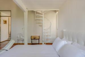 Posteľ alebo postele v izbe v ubytovaní Villa I Barronci Resort & Spa
