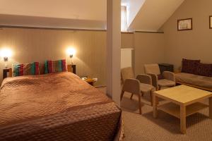 Postel nebo postele na pokoji v ubytování Hotel Merlot
