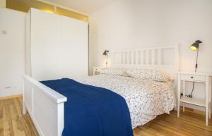 Een bed of bedden in een kamer bij Pineta House Vidos