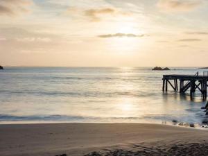 a pier sitting on the beach with the ocean at Boomer Beach Retreat - Pet-Friendly - WiFi in Port Elliot