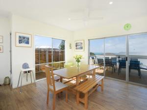a dining room with a table and chairs at Boomer Beach Retreat - Pet-Friendly - WiFi in Port Elliot