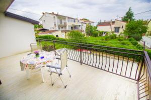 Een balkon of terras bij Pineta House Vidos