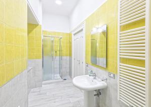 a bathroom with a sink and a shower at B&B Rest a Napoli in Naples