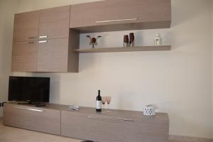 TV a/nebo společenská místnost v ubytování Residence La Perla