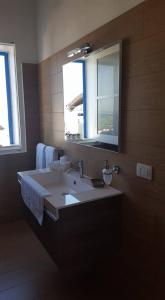 A bed or beds in a room at Porto Gaio Accomodation