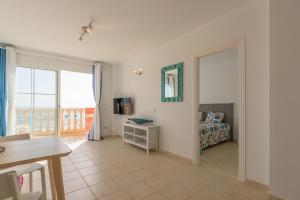 a room with a bedroom with a bed and a window at THE PARADISE ON THE OCEAN 3 in Costa Calma