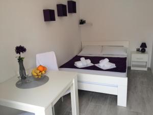 Postel nebo postele na pokoji v ubytování Apartments Nina