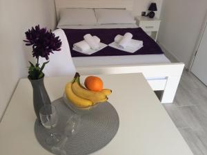Postel nebo postele na pokoji v ubytování Apartments Nina