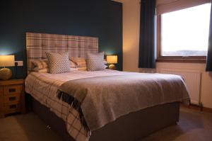 A bed or beds in a room at Davar 