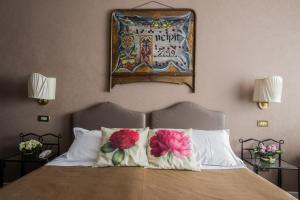 Postel nebo postele na pokoji v ubytování Hotel Residenza In Farnese
