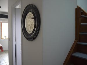 a mirror on the wall in a hallway at Vieille Ville 2 - La Petite Maison à Safranier, 2 bedrooms, max 4 adults and 2 kids in Antibes