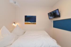 Cama ou camas em um quarto em Appartement-Moin
