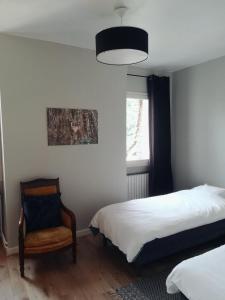 Postel nebo postele na pokoji v ubytování Maison Angulus Ridet