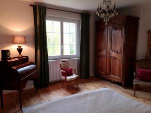 Postel nebo postele na pokoji v ubytování Maison Angulus Ridet