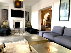 a living room with a couch and a table at Palais Souad in Marrakesh