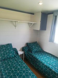 Giường trong phòng chung tại Les chalets de Bes "Le Campagnard "