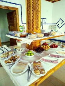 a table with many plates of food on it at Malika Prime Hotel in Samarkand