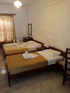 A bed or beds in a room at Studios Stavris