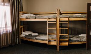 a group of bunk beds in a room at Meteor apartment XXL in Cluj-Napoca